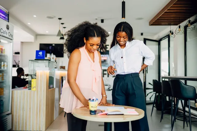 Women collaborating in Lagos cafe